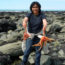 Happy Argentine Girl with two Centollas (Sea Spiders)